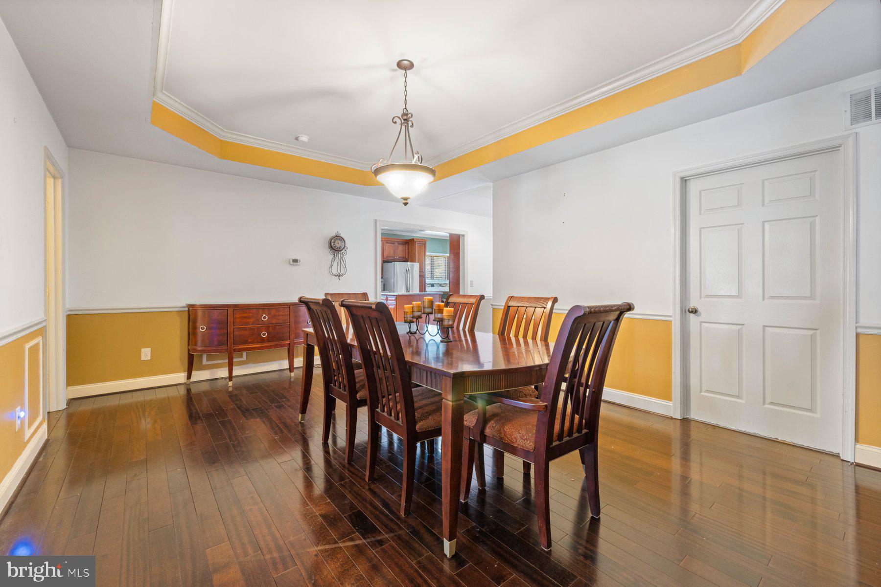 61 Magothy Beach Road Pasadena, MD 21122 - Photo 13 of 63 a view of a dining room with furniture window and wooden floor