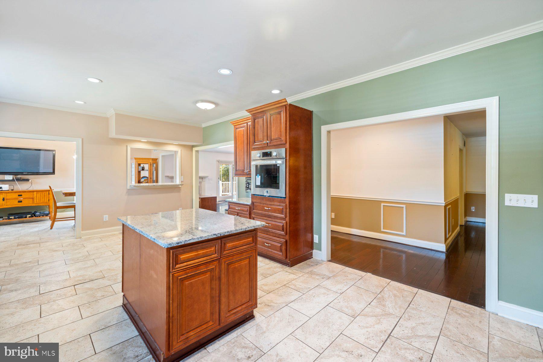 61 Magothy Beach Road Pasadena, MD 21122 - Photo 16 of 63 a kitchen with stainless steel appliances granite countertop a refrigerator and a sink