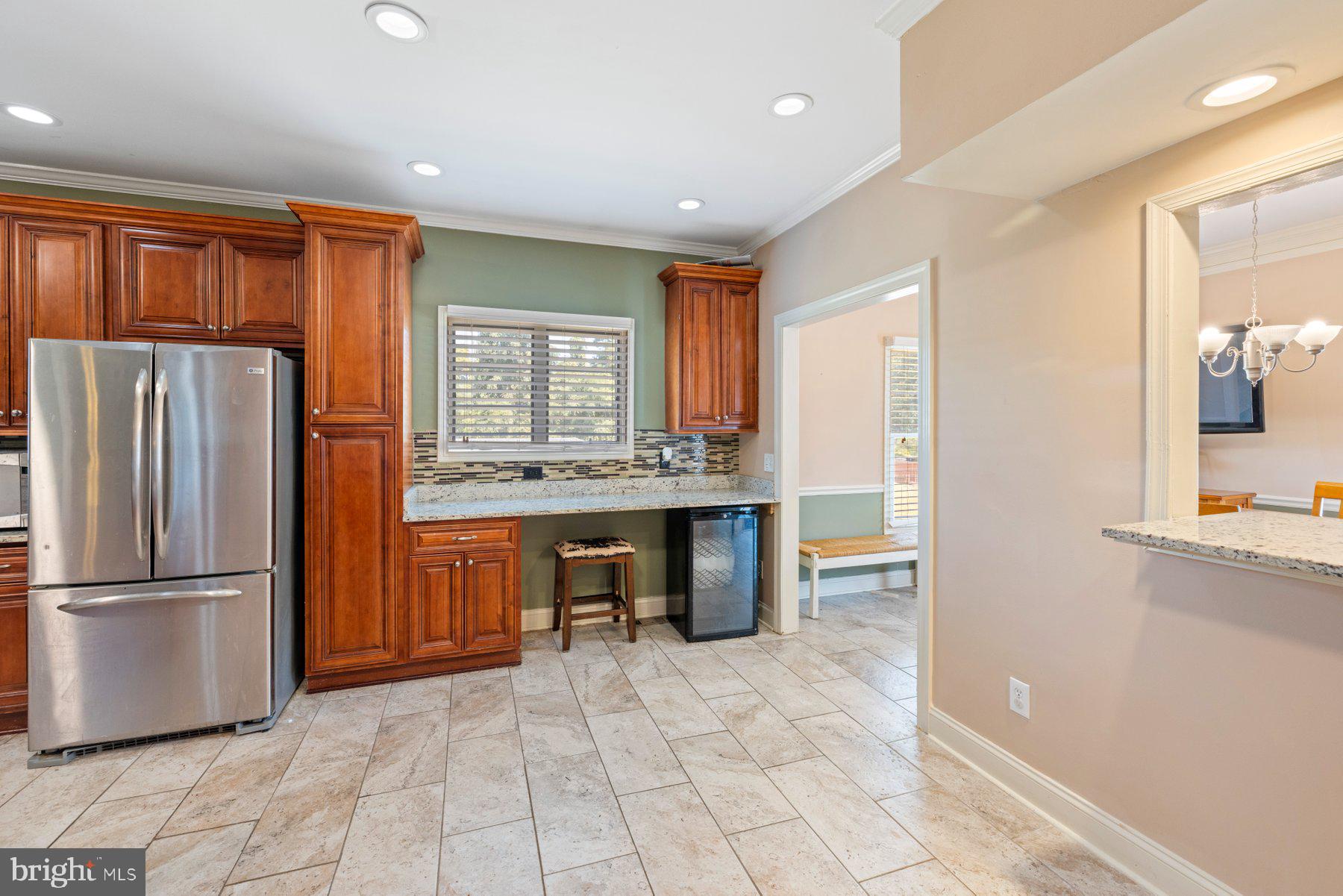 61 Magothy Beach Road Pasadena, MD 21122 - Photo 19 of 63 a kitchen with stainless steel appliances granite countertop a refrigerator and a sink