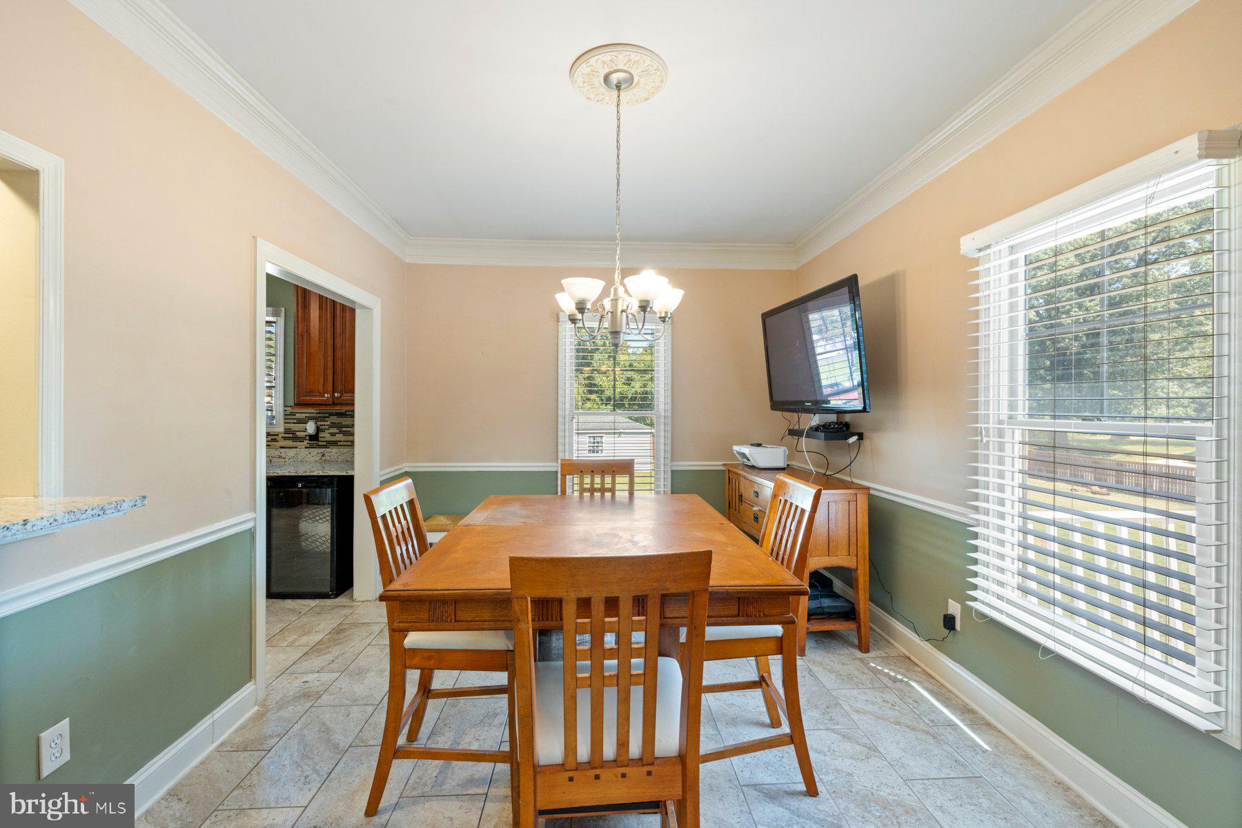 61 Magothy Beach Road Pasadena, MD 21122 - Photo 22 of 63 a dining room with furniture and window
