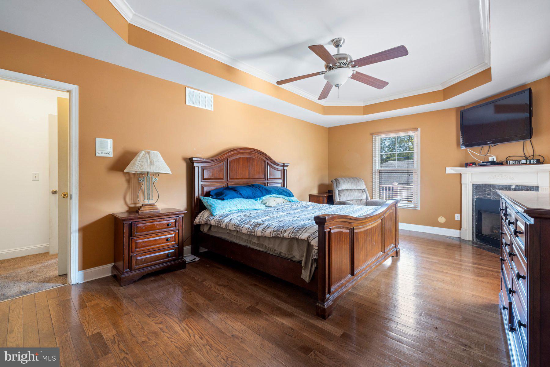 61 Magothy Beach Road Pasadena, MD 21122 - Photo 27 of 63 a bedroom with a bed and a chandelier