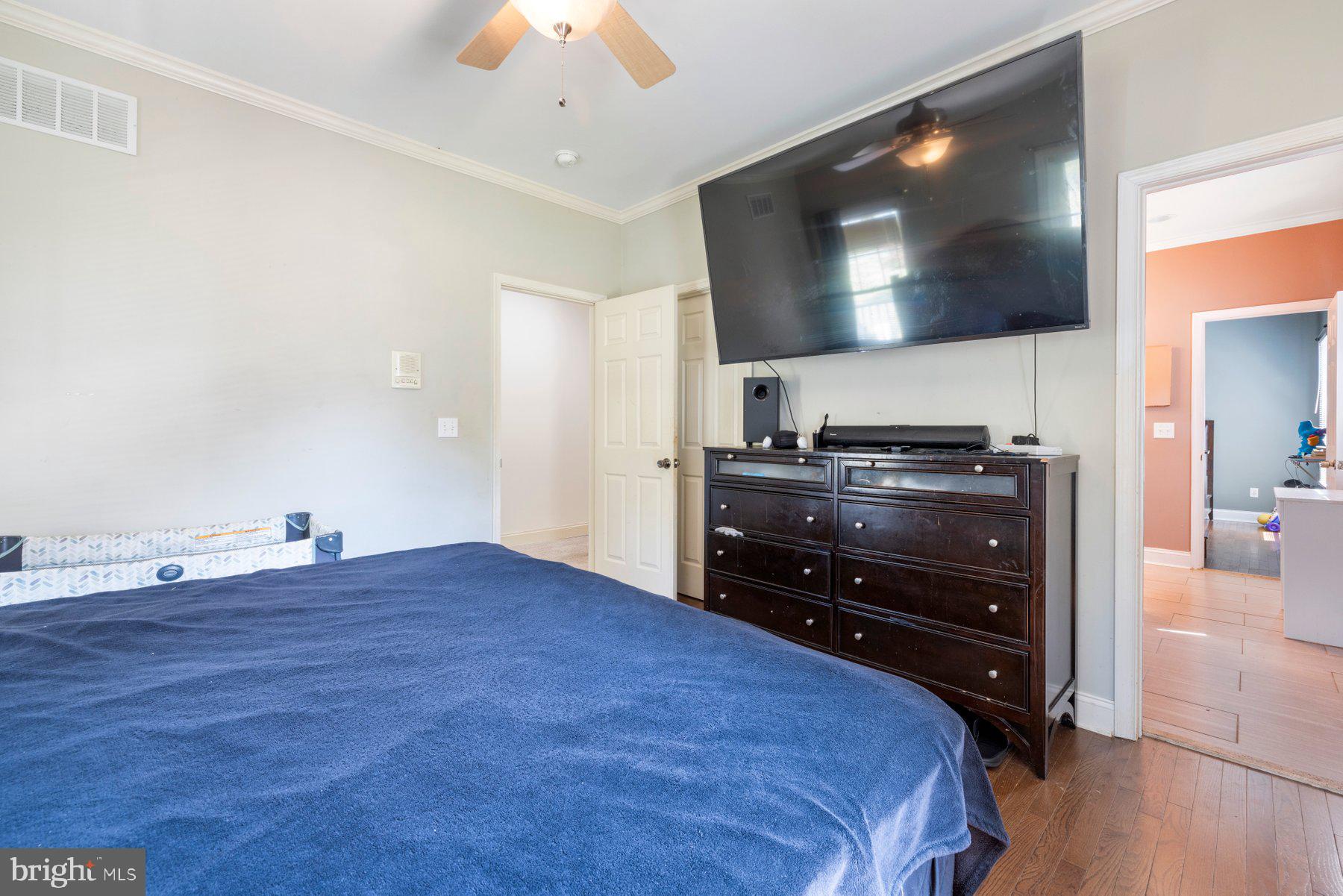 61 Magothy Beach Road Pasadena, MD 21122 - Photo 31 of 63 a bedroom with a bed and flat screen tv