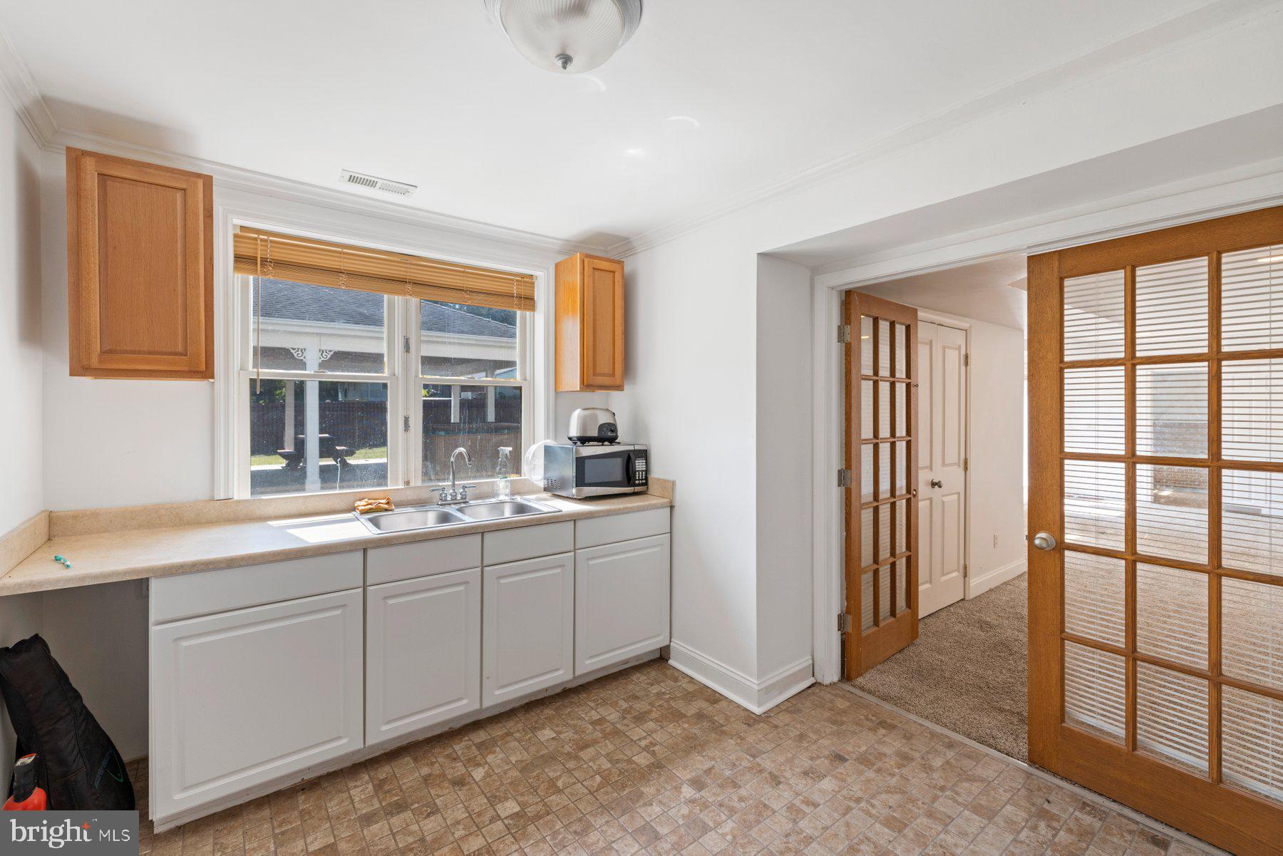 61 Magothy Beach Road Pasadena, MD 21122 - Photo 39 of 63 a view of a sink and a window