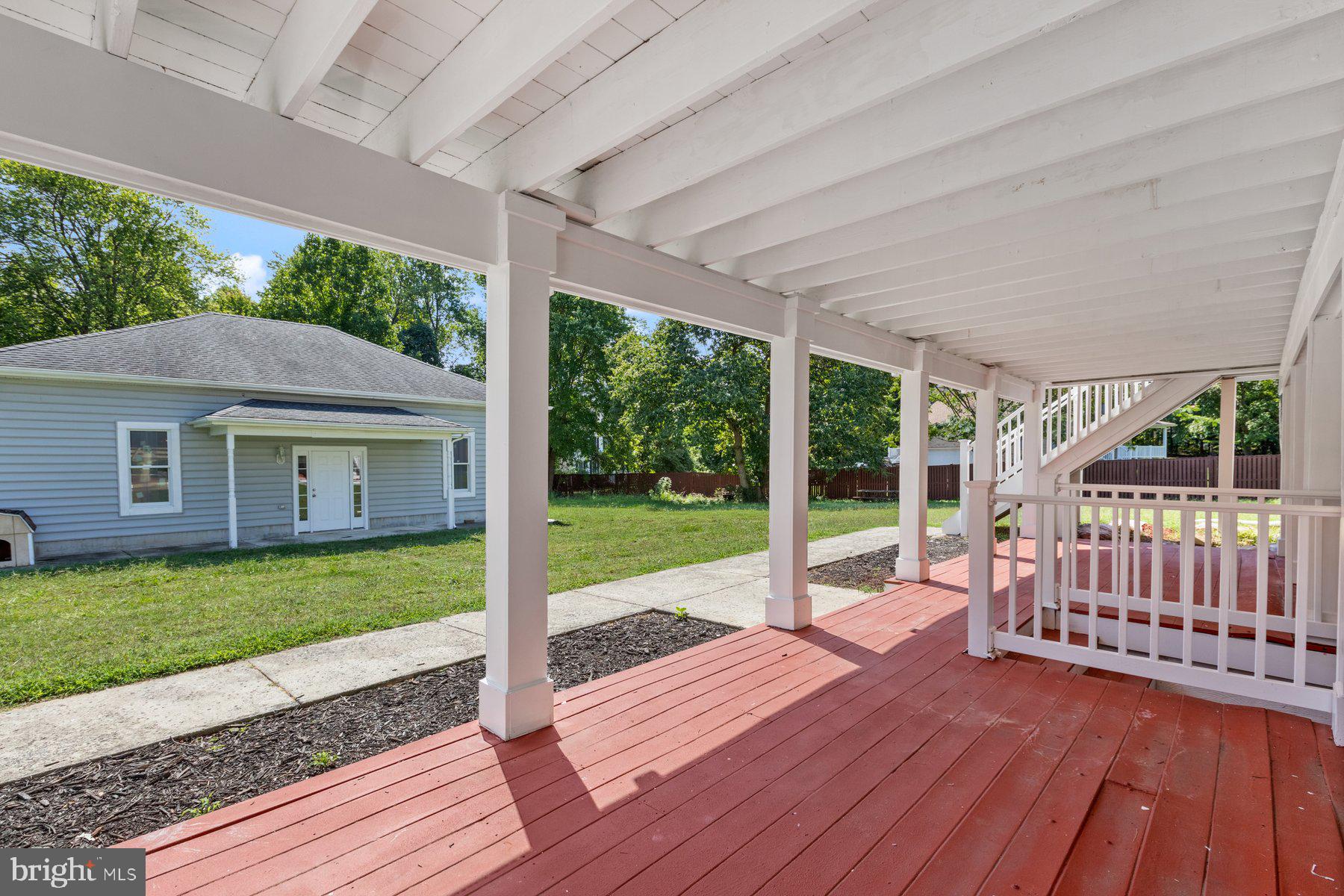 61 Magothy Beach Road Pasadena, MD 21122 - Photo 5 of 63 a view of a house with backyard and porch
