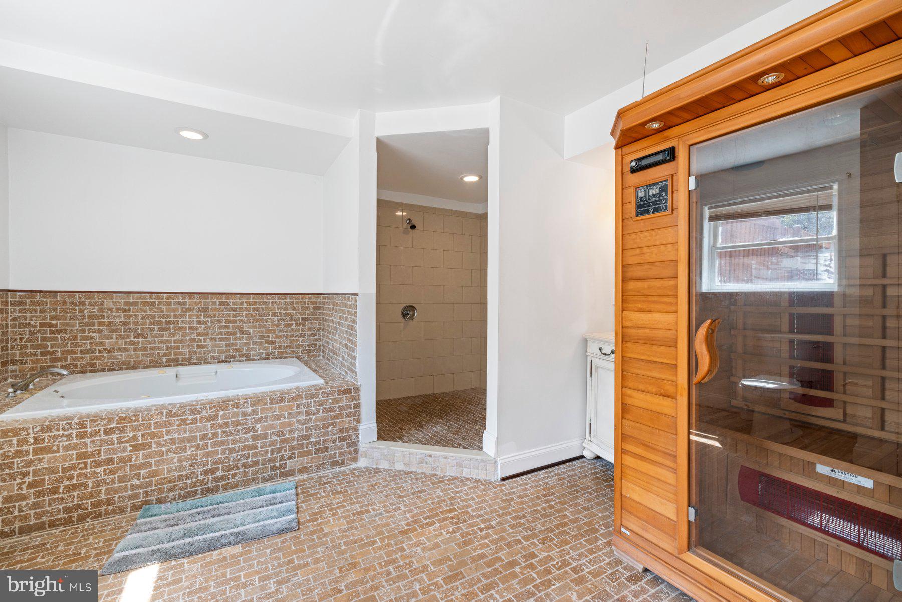 61 Magothy Beach Road Pasadena, MD 21122 - Photo 51 of 63 a bathroom with a bathtub and a shower