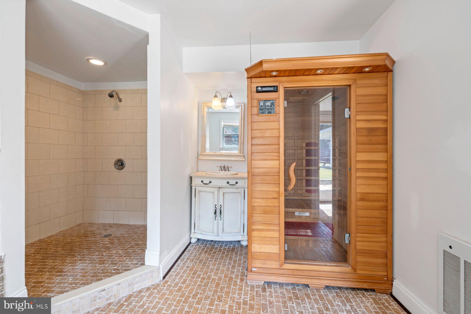 61 Magothy Beach Road Pasadena, MD 21122 - Photo 52 of 63 a bathroom with a glass door shower