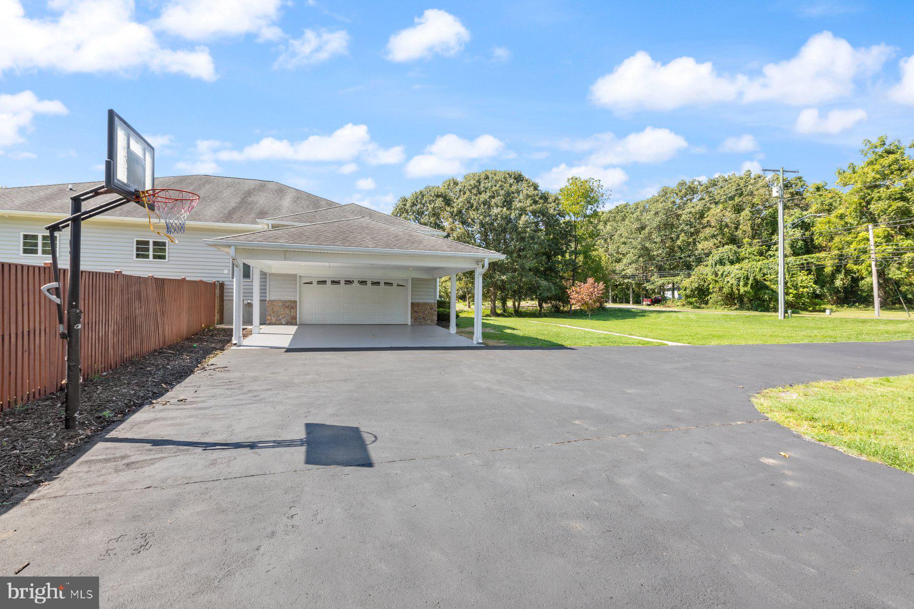 61 Magothy Beach Road Pasadena, MD 21122 - Photo 58 of 63 a view of a house with a yard and fence