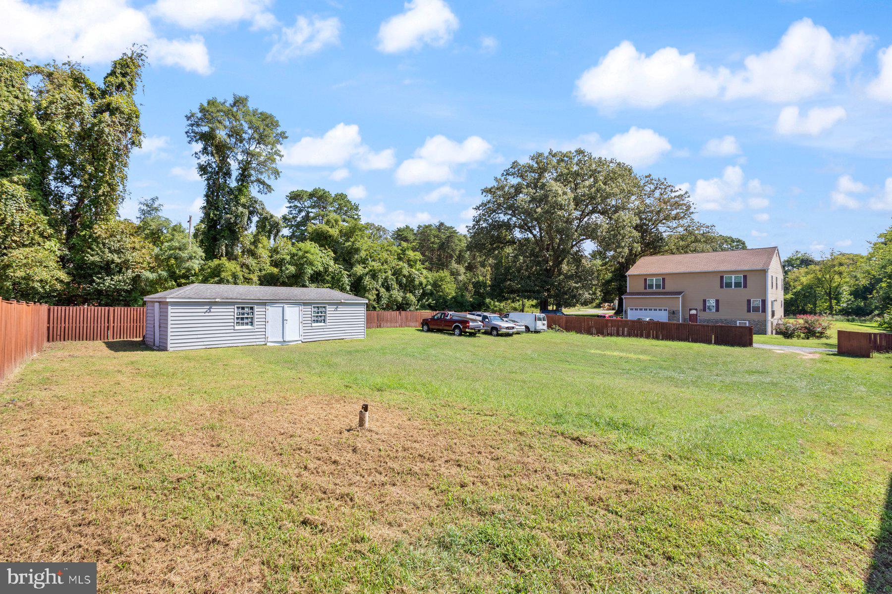 61 Magothy Beach Road Pasadena, MD 21122 - Photo 59 of 63 a backyard of a house with lots of green space