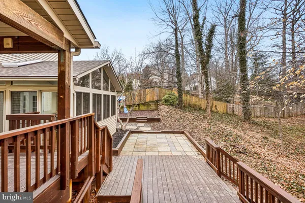 a view of balcony with wooden floor and fence