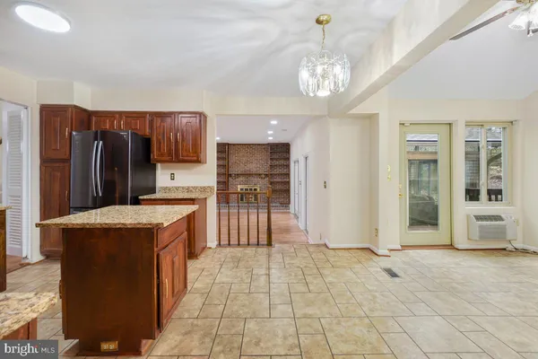 a kitchen with stainless steel appliances granite countertop a refrigerator oven a sink and dishwasher