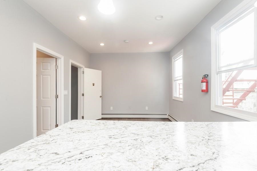 705 8th Street, Unit 2 Union City, NJ 07087 - Photo 13 of 19 a view of a big room with windows and closet