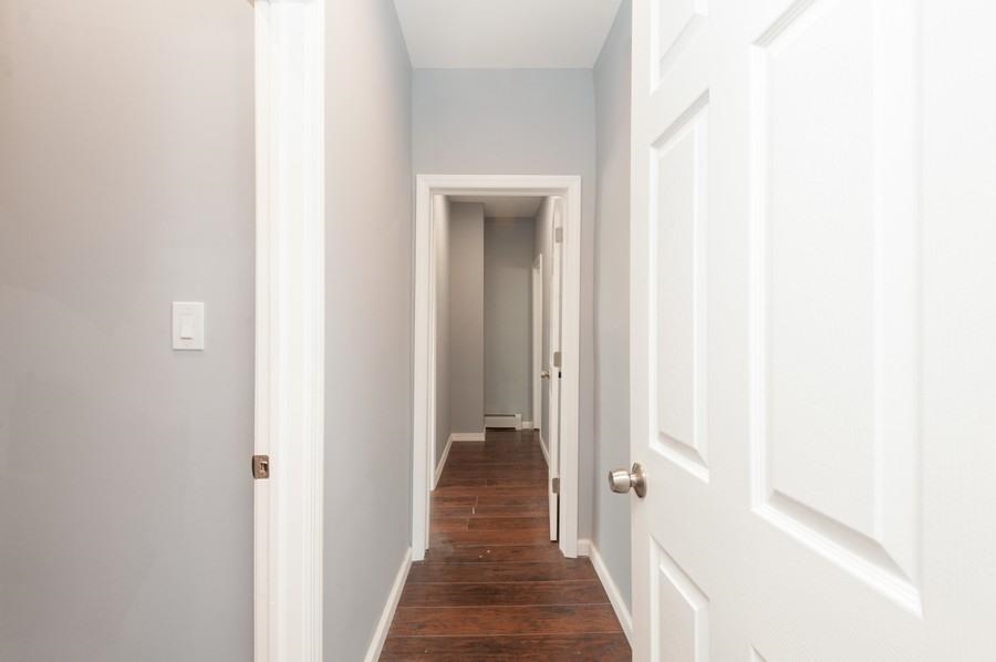 705 8th Street, Unit 2 Union City, NJ 07087 - Photo 14 of 19 a view of a hallway with wooden floor