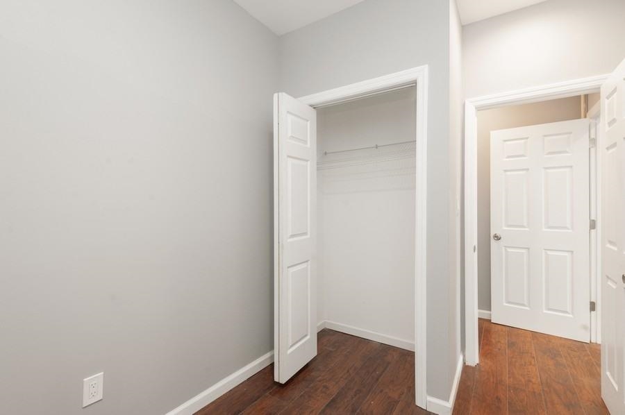 705 8th Street, Unit 2 Union City, NJ 07087 - Photo 16 of 19 a view of front door with wooden floor