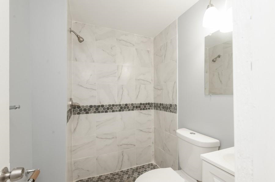 705 8th Street, Unit 2 Union City, NJ 07087 - Photo 19 of 19 a bathroom with a toilet and a shower