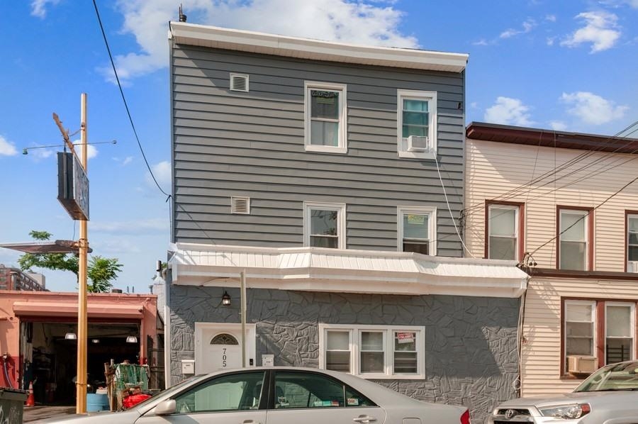 705 8th Street, Unit 2 Union City, NJ 07087 - Photo 2 of 19 a front view of a house with parking space