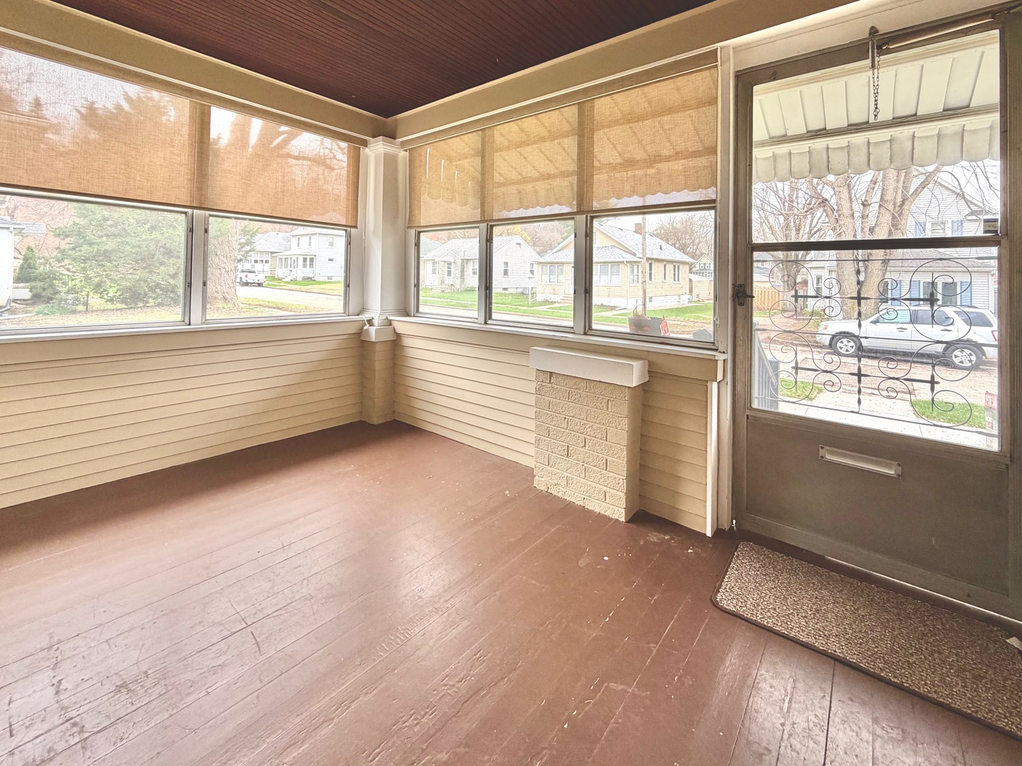 422 45th Street Moline, IL 61265 - Photo 4 of 22 a view of an empty room with a window and wooden floor