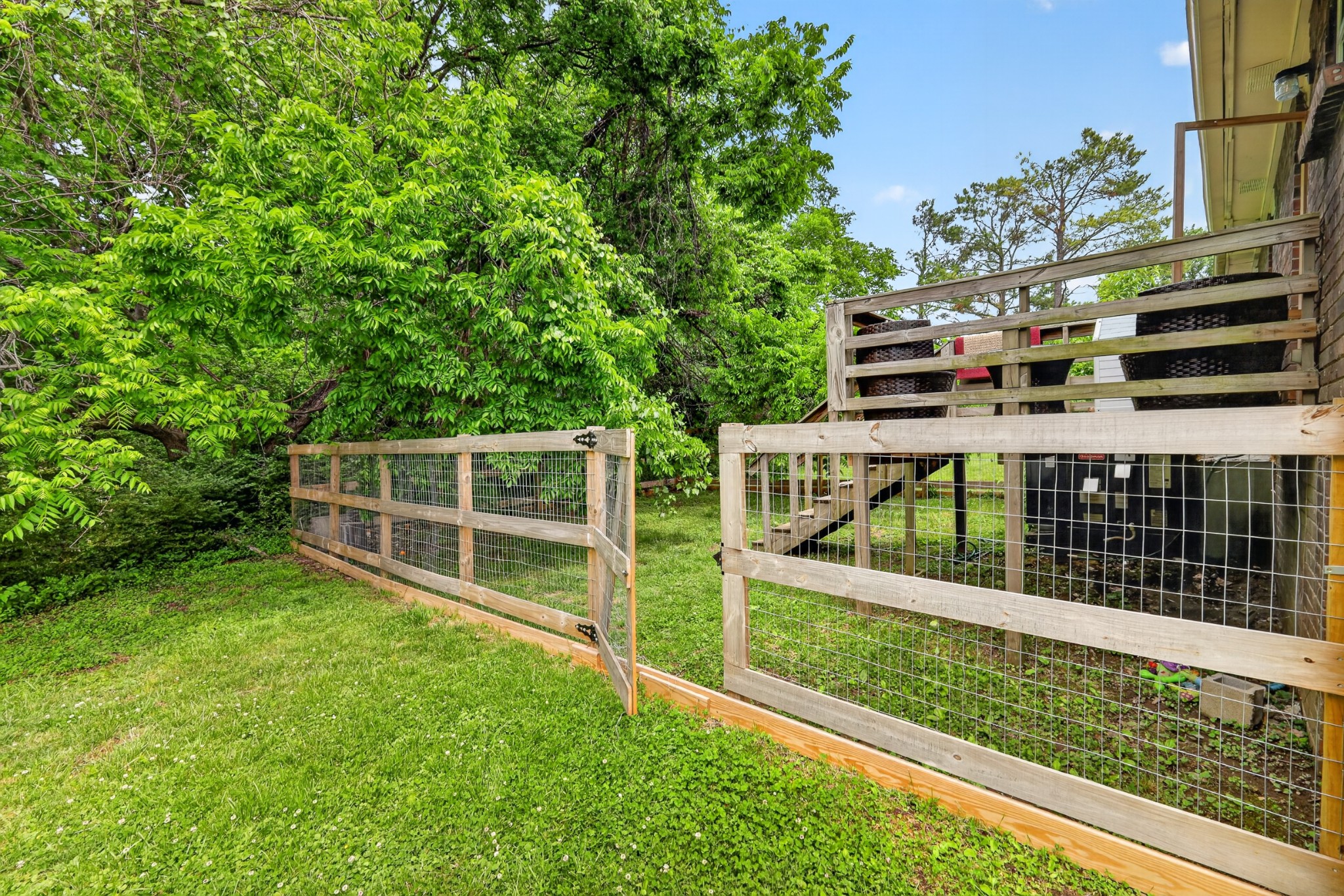 1314 Bellshire Terrace Drive Nashville, TN 37207 - Photo 15 of 15 a view of a backyard with wooden fence and large trees