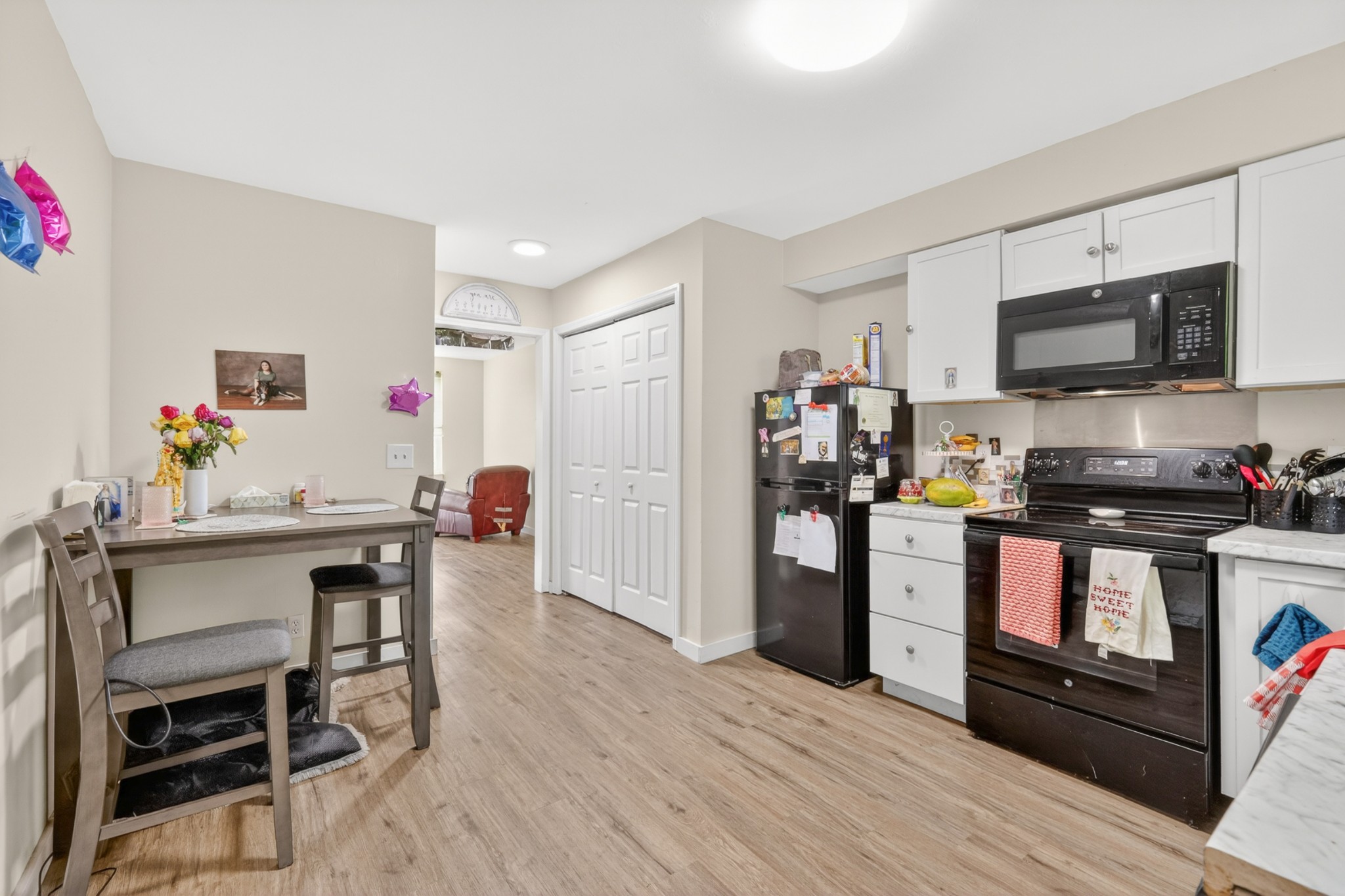 1314 Bellshire Terrace Drive Nashville, TN 37207 - Photo 5 of 15 a kitchen with stainless steel appliances a stove top oven a sink dishwasher and a refrigerator with wooden floor