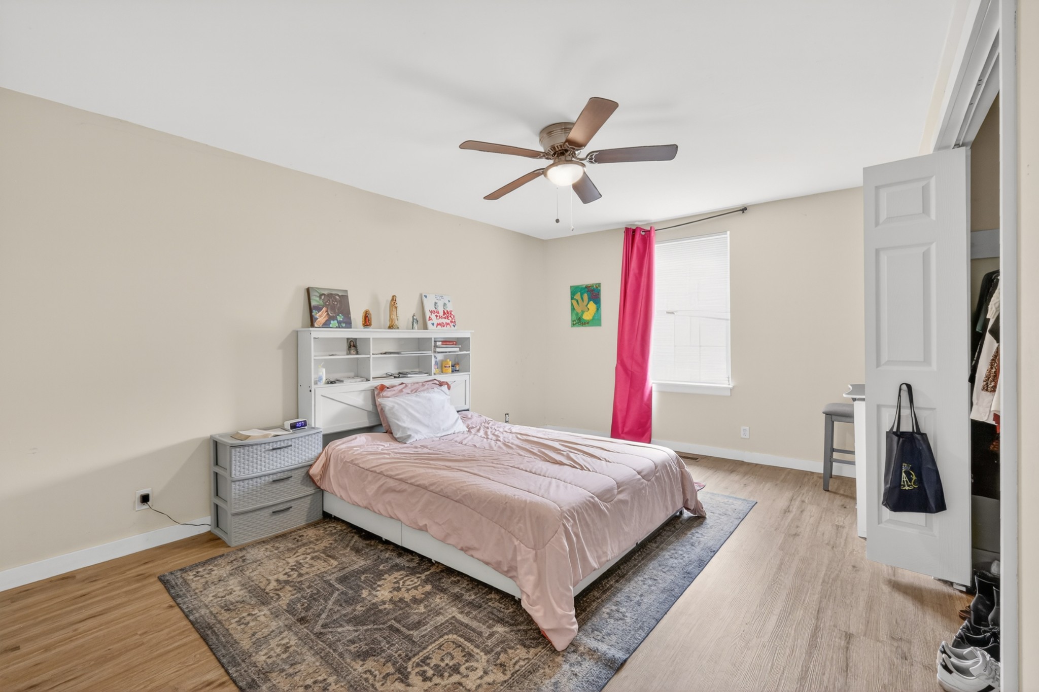 1314 Bellshire Terrace Drive Nashville, TN 37207 - Photo 6 of 15 a bedroom with a large bed and a chandelier