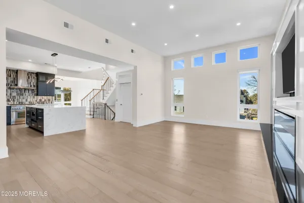 a view of a kitchen with a sink cabinets and a living room
