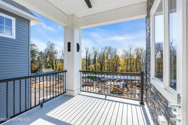 a view of a balcony with wooden floor