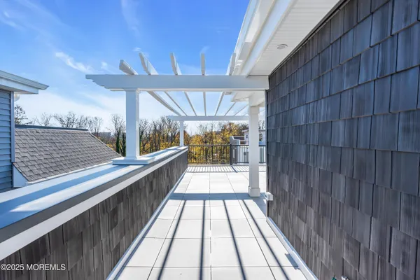 a view of balcony with wooden floor