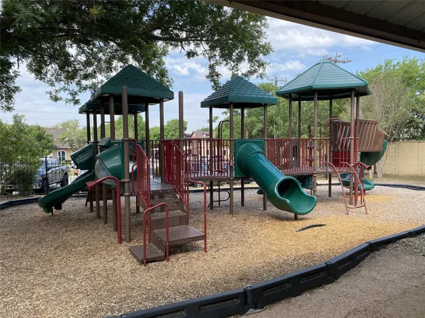 a view of a chairs and table in the patio