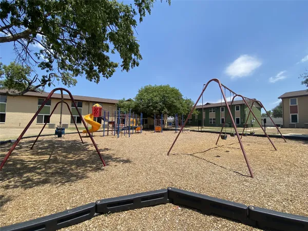 a swimming pool with some trees in the background