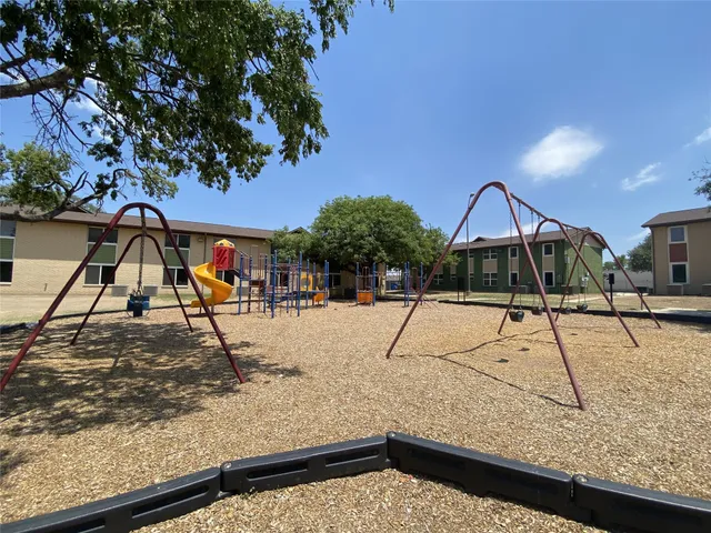 a swimming pool with some trees in the background