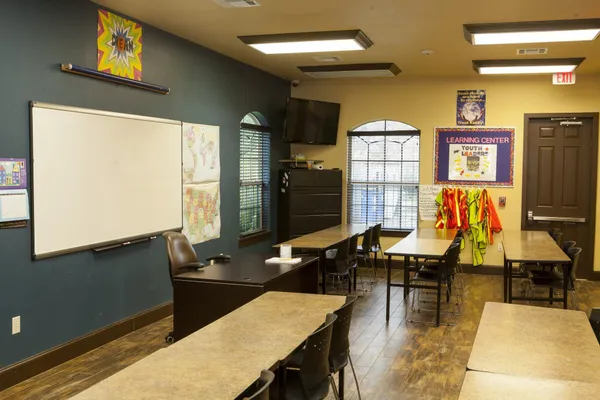 a living room with dining room and kitchen view