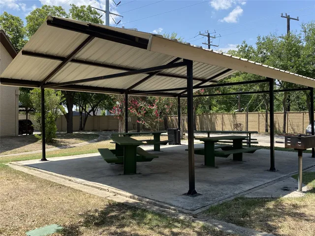 a view of a swimming pool with a patio