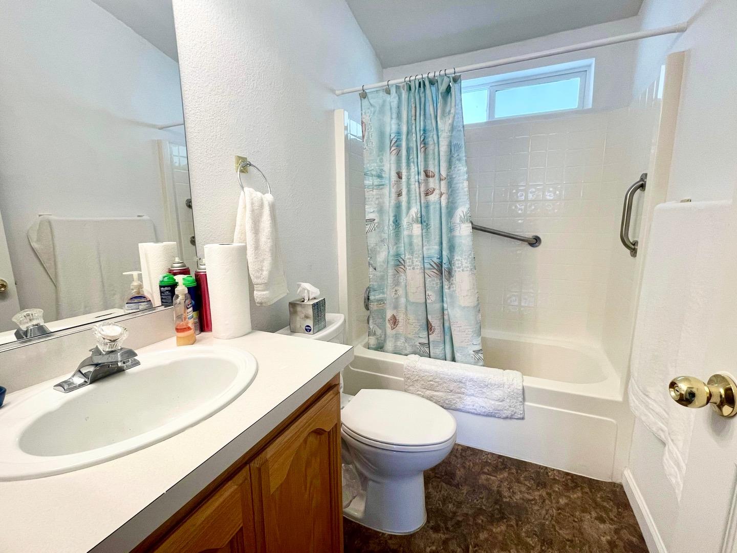 711 Old Canyon Road, Unit 13 Fremont, CA 94536 - Photo 14 of 26 a bathroom with a sink toilet and shower