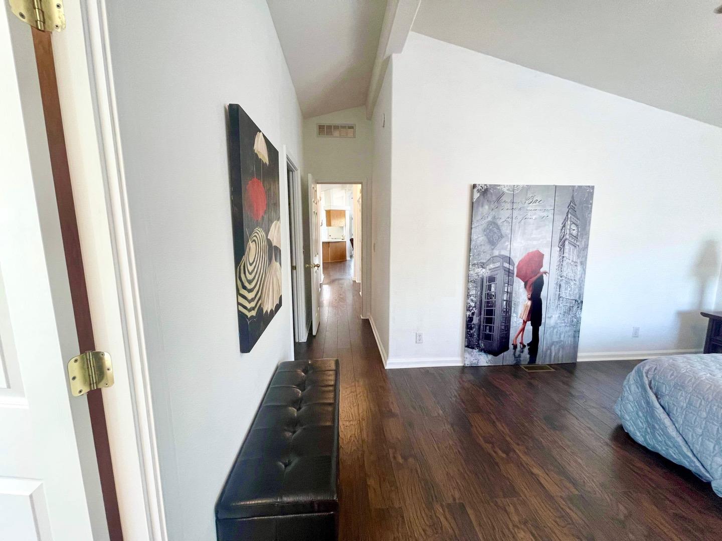711 Old Canyon Road, Unit 13 Fremont, CA 94536 - Photo 18 of 26 a view of a hallway with wooden floor and stairs