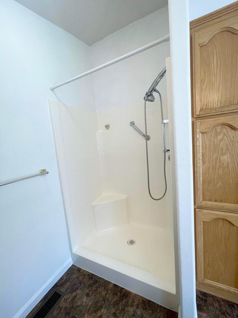 711 Old Canyon Road, Unit 13 Fremont, CA 94536 - Photo 21 of 26 a bathroom with a glass shower door