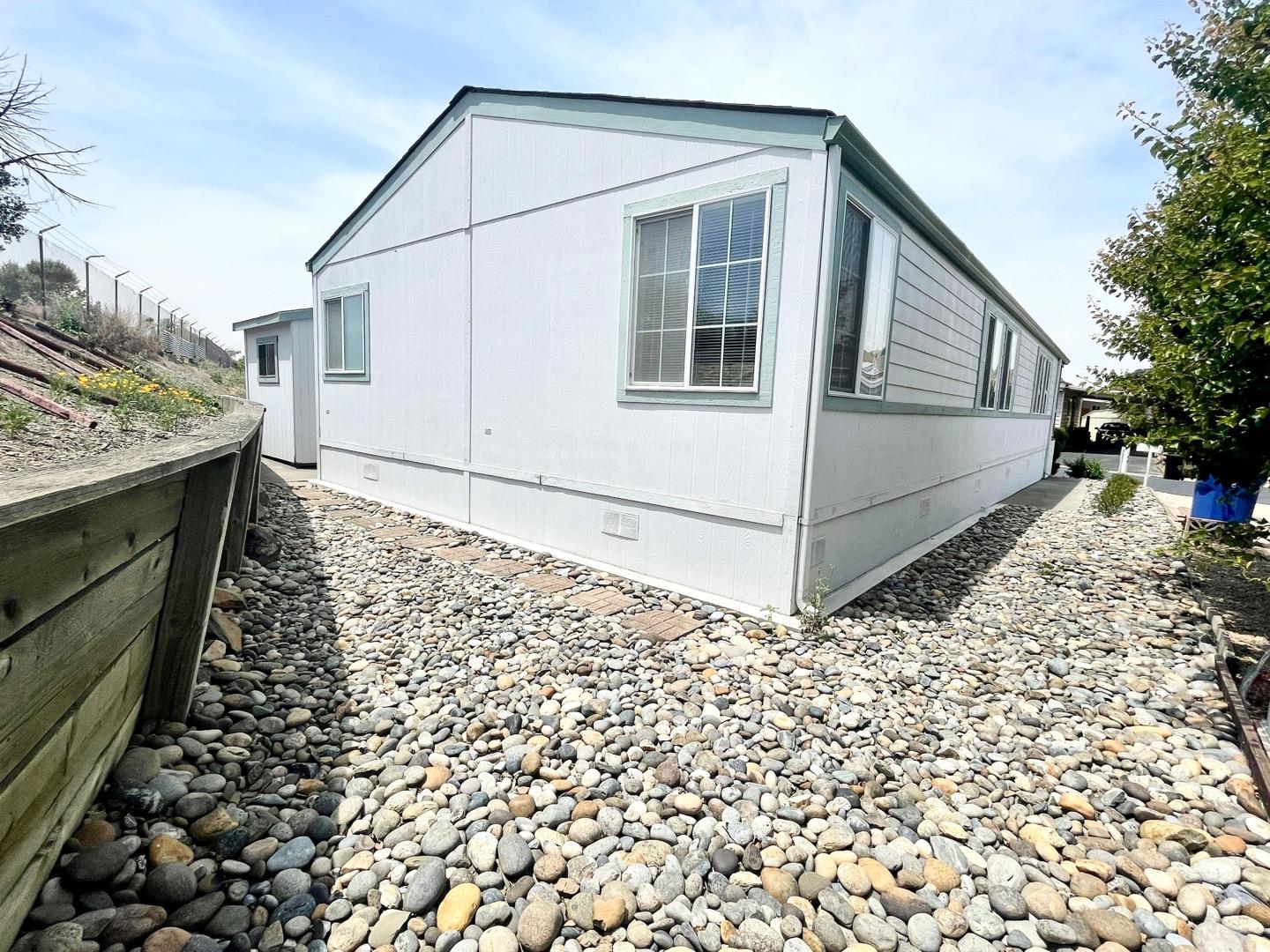 711 Old Canyon Road, Unit 13 Fremont, CA 94536 - Photo 26 of 26 a view of a house with a yard