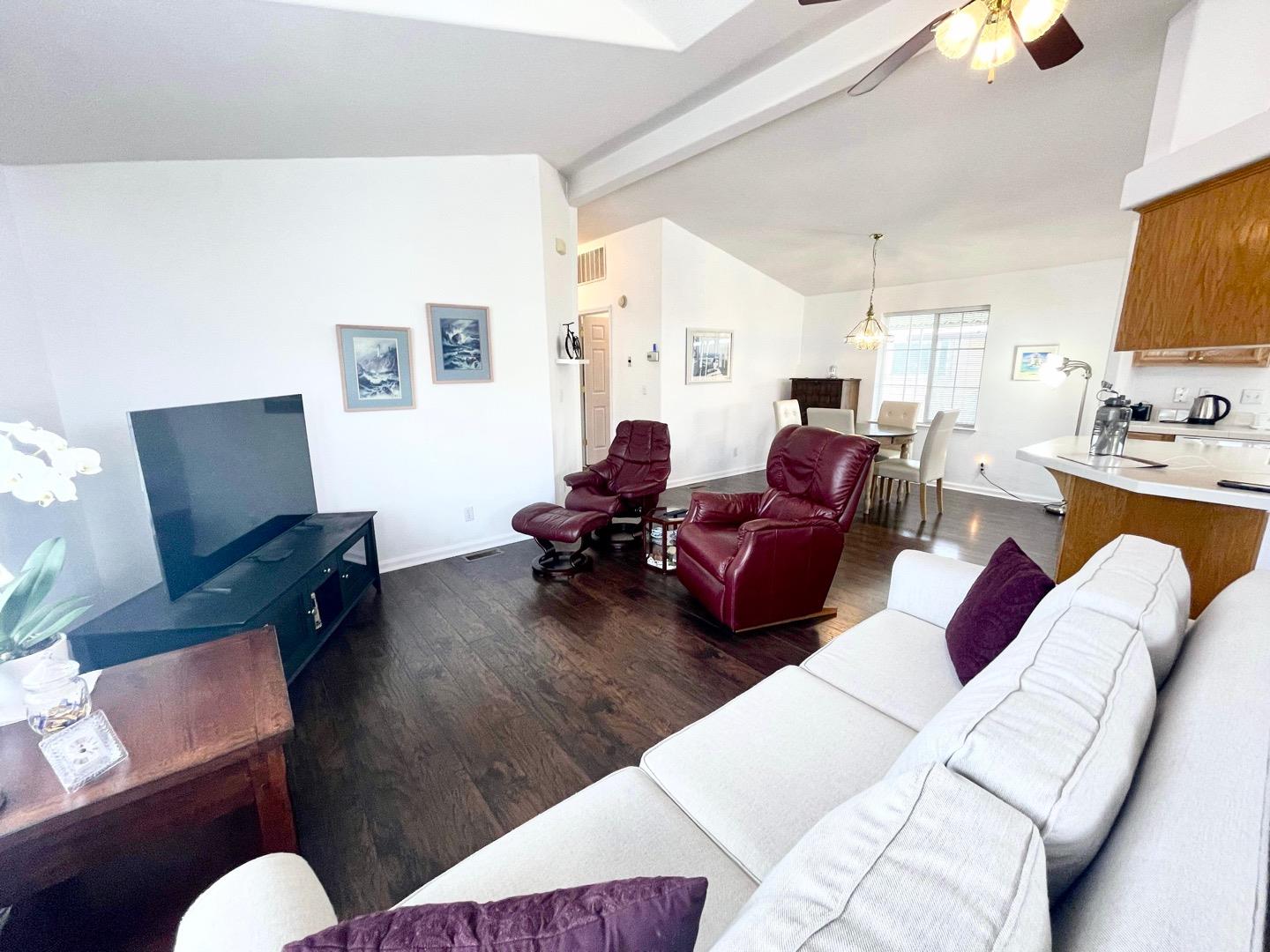 711 Old Canyon Road, Unit 13 Fremont, CA 94536 - Photo 3 of 26 a living room with furniture or couch and a flat screen tv