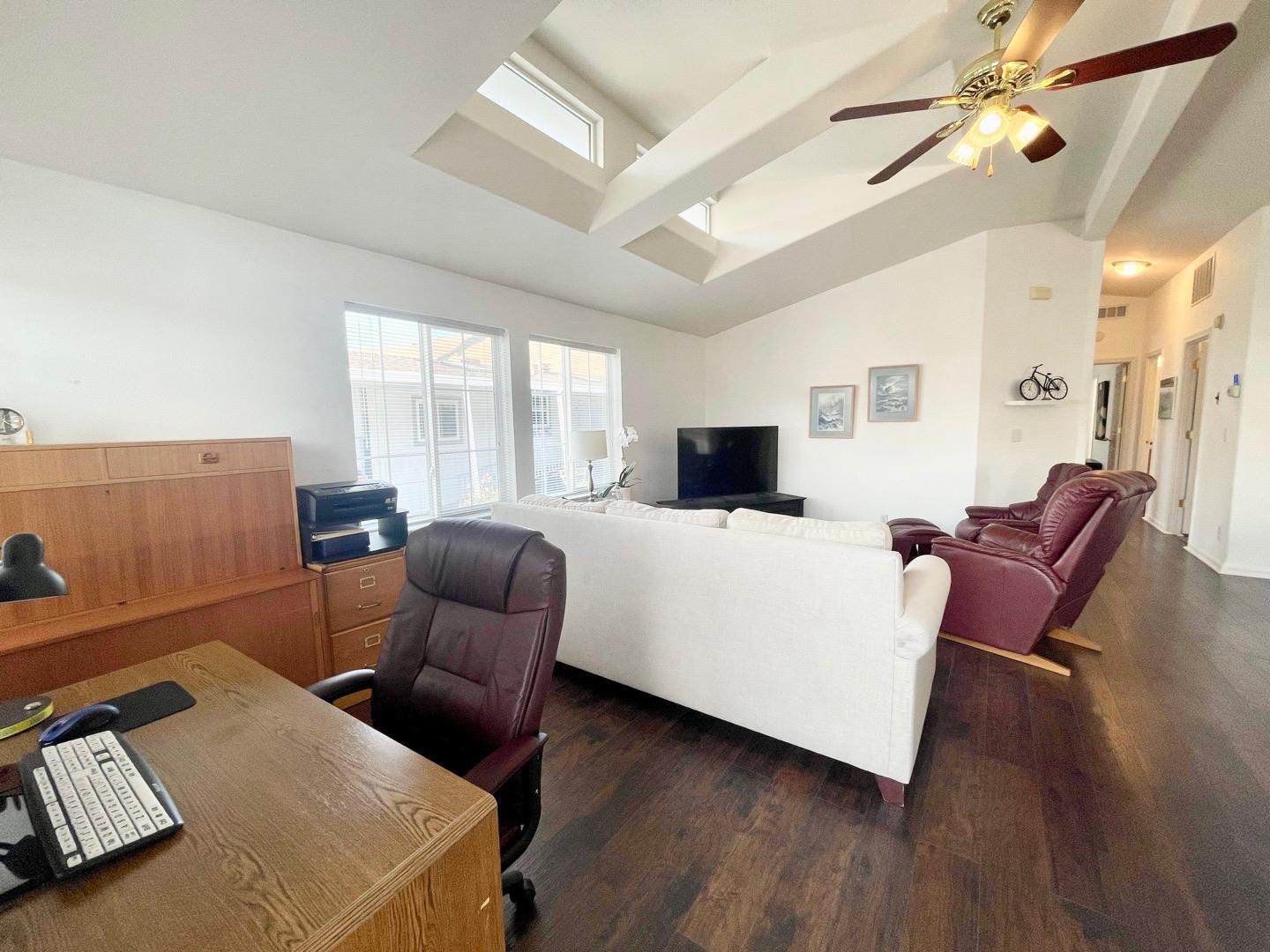 711 Old Canyon Road, Unit 13 Fremont, CA 94536 - Photo 5 of 26 a living room with furniture and a flat screen tv