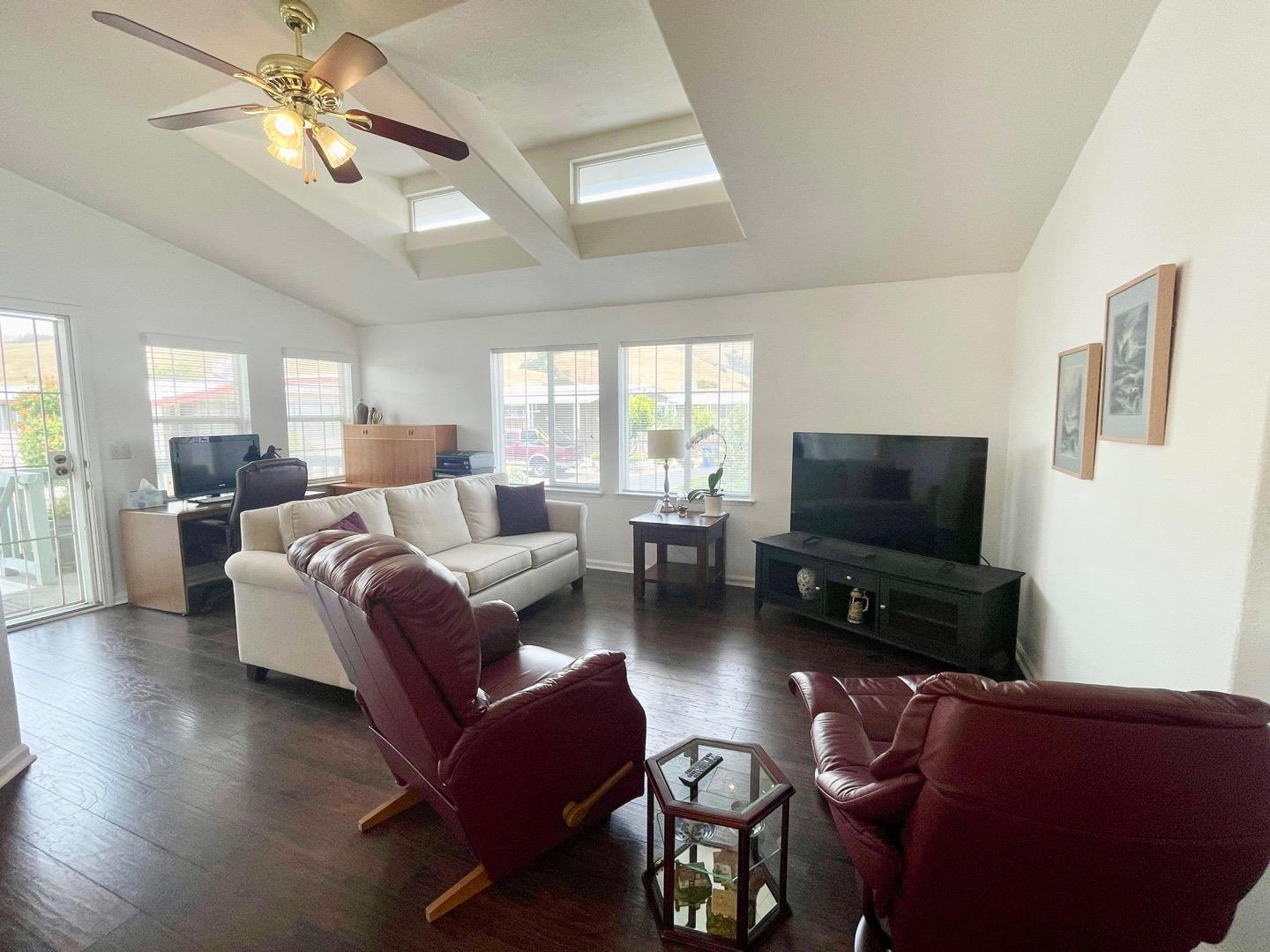 711 Old Canyon Road, Unit 13 Fremont, CA 94536 - Photo 8 of 26 a living room with furniture and a flat screen tv