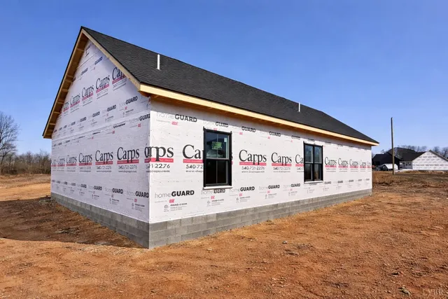a view of a livingroom with furniture and hardwood floor
