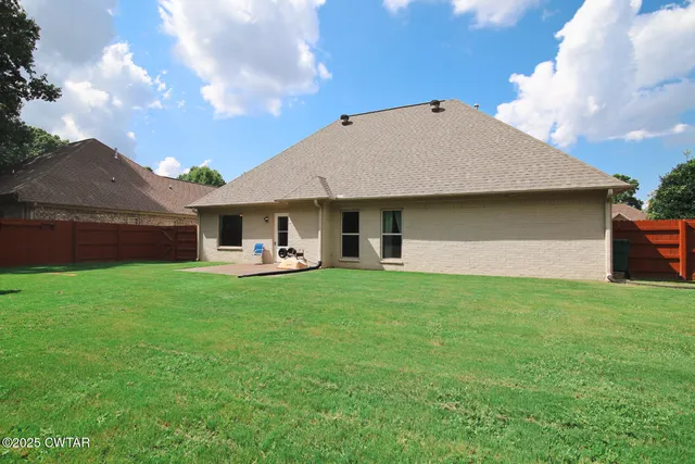 a house view with a garden space