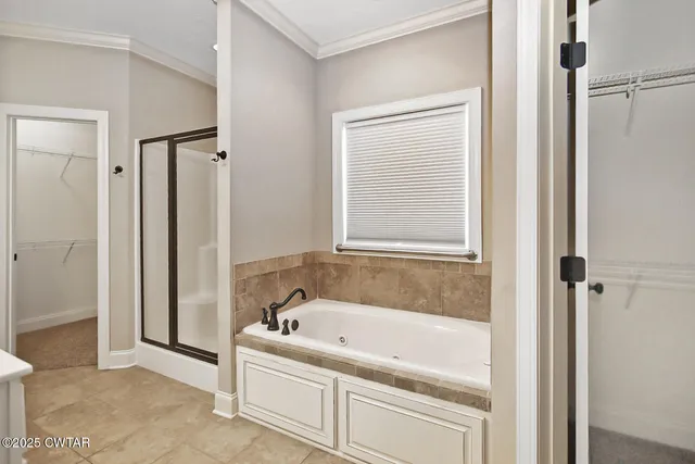 a white bath tub sitting next to a window