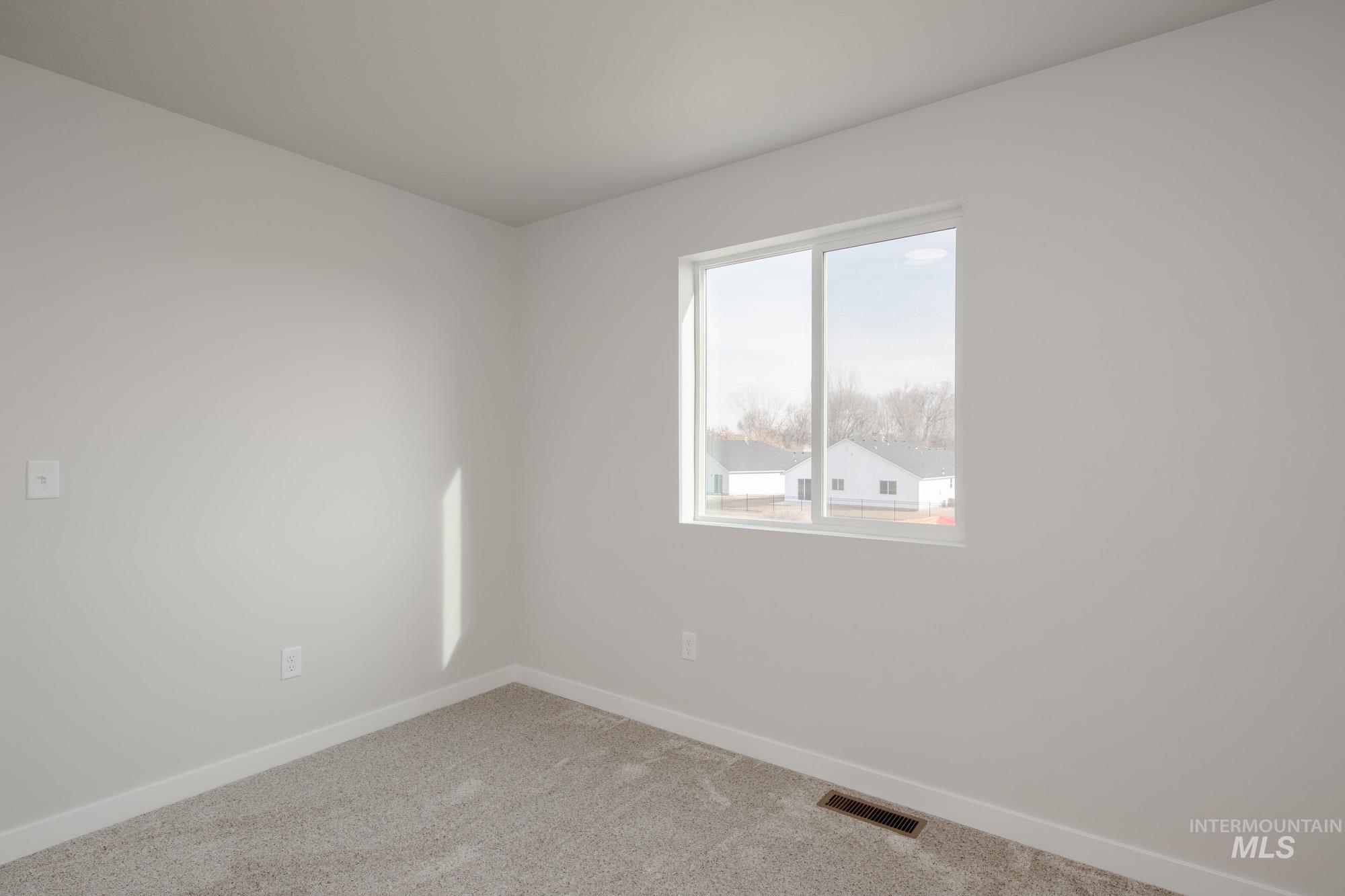 2462 West Fallon Loop Nampa, ID 83651 - Photo 18 of 23 Carpeted empty room with baseboards