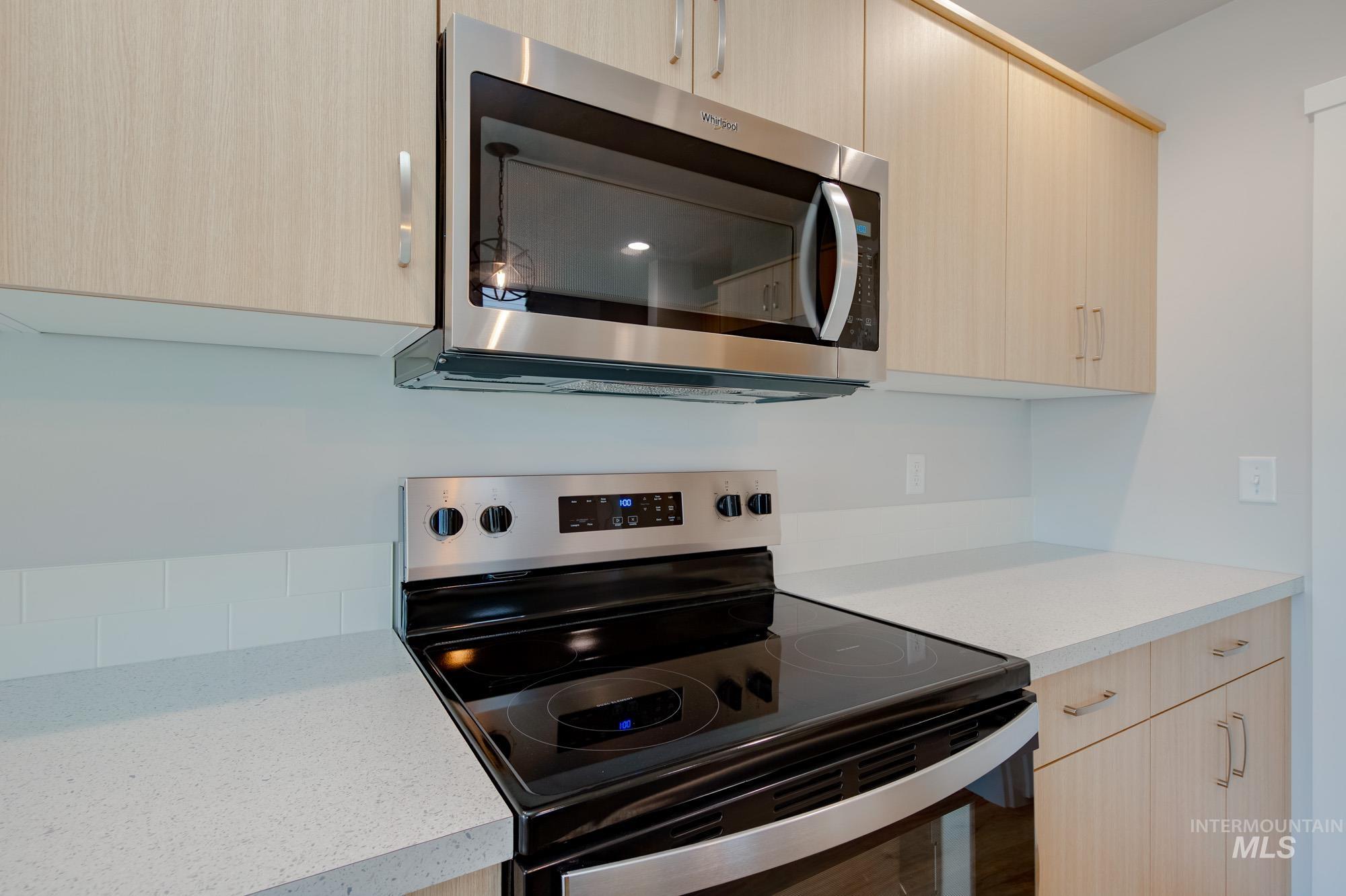 2462 West Fallon Loop Nampa, ID 83651 - Photo 8 of 23 Kitchen featuring stainless steel appliances, light brown cabinets, and modern cabinets