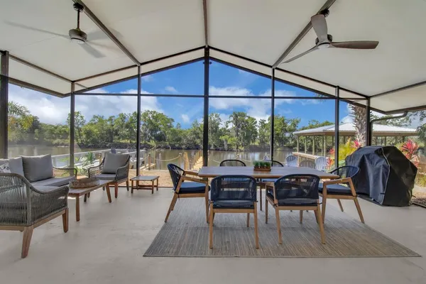 a view of a dining room with furniture window and outside view
