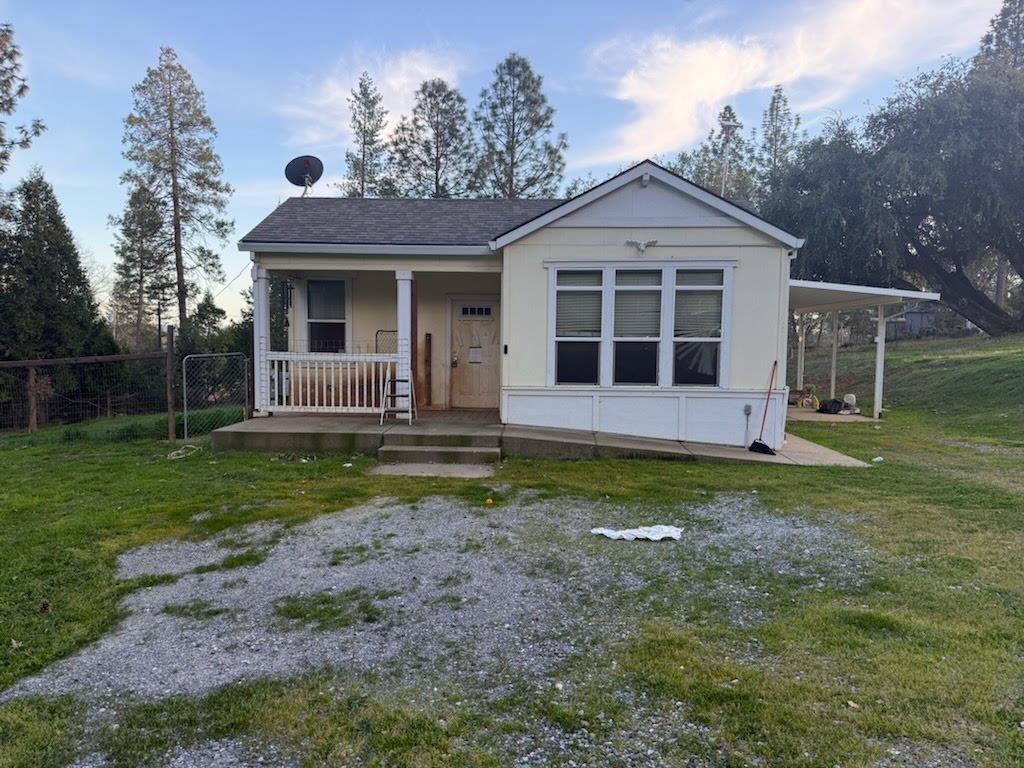 front view of a house with a yard