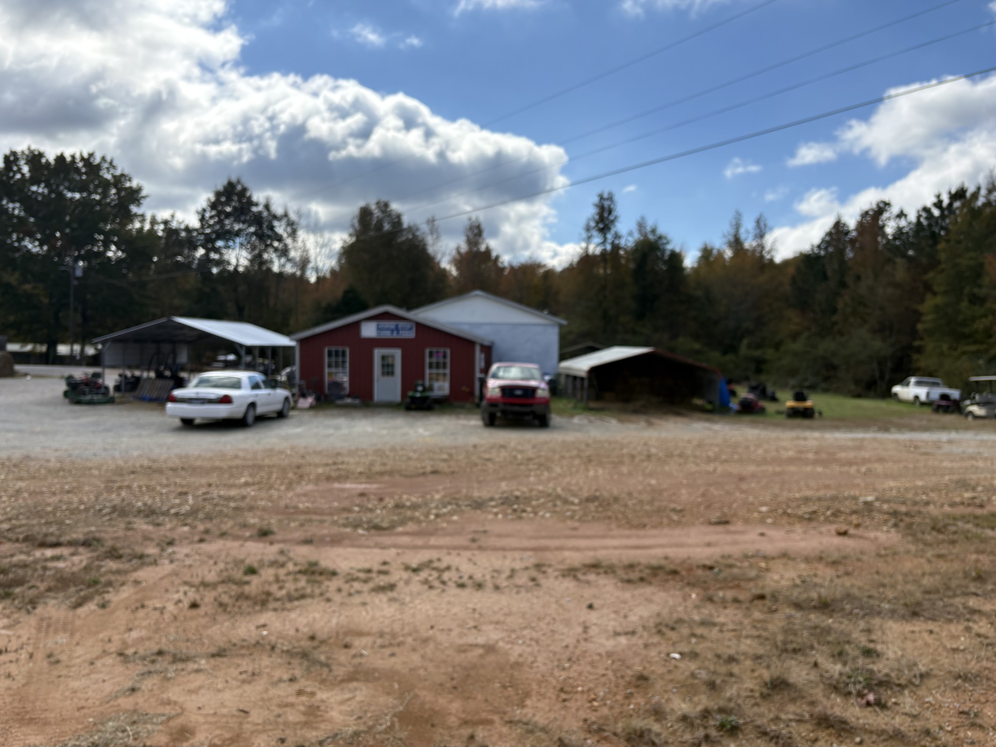 106 Cotham Road Hohenwald, TN 38462 - Photo 14 of 14 a car parked in front of a house