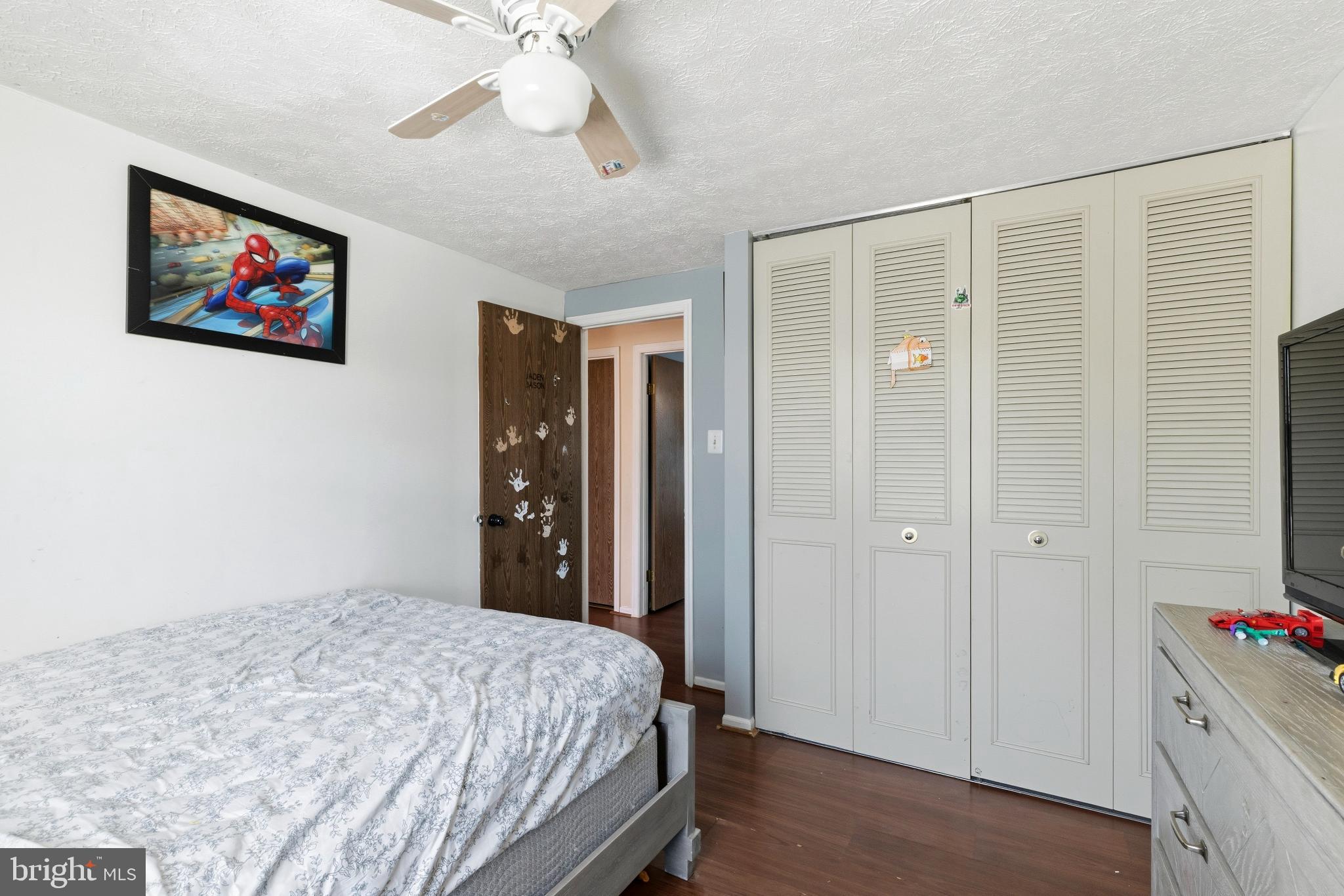 721 Rainbow Court Edgewood, MD 21040 - Photo 15 of 25 a bedroom with a bed and a chandelier