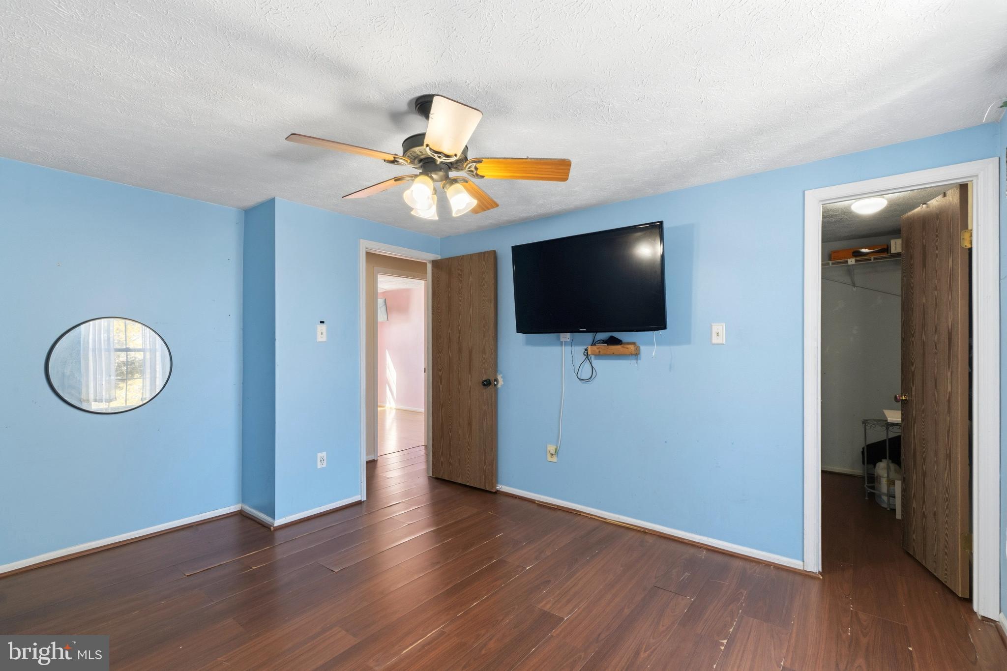 721 Rainbow Court Edgewood, MD 21040 - Photo 18 of 25 an empty room with wooden floor and mirror
