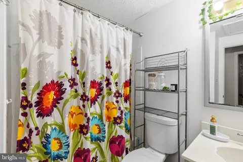 a bathroom with a shower curtain