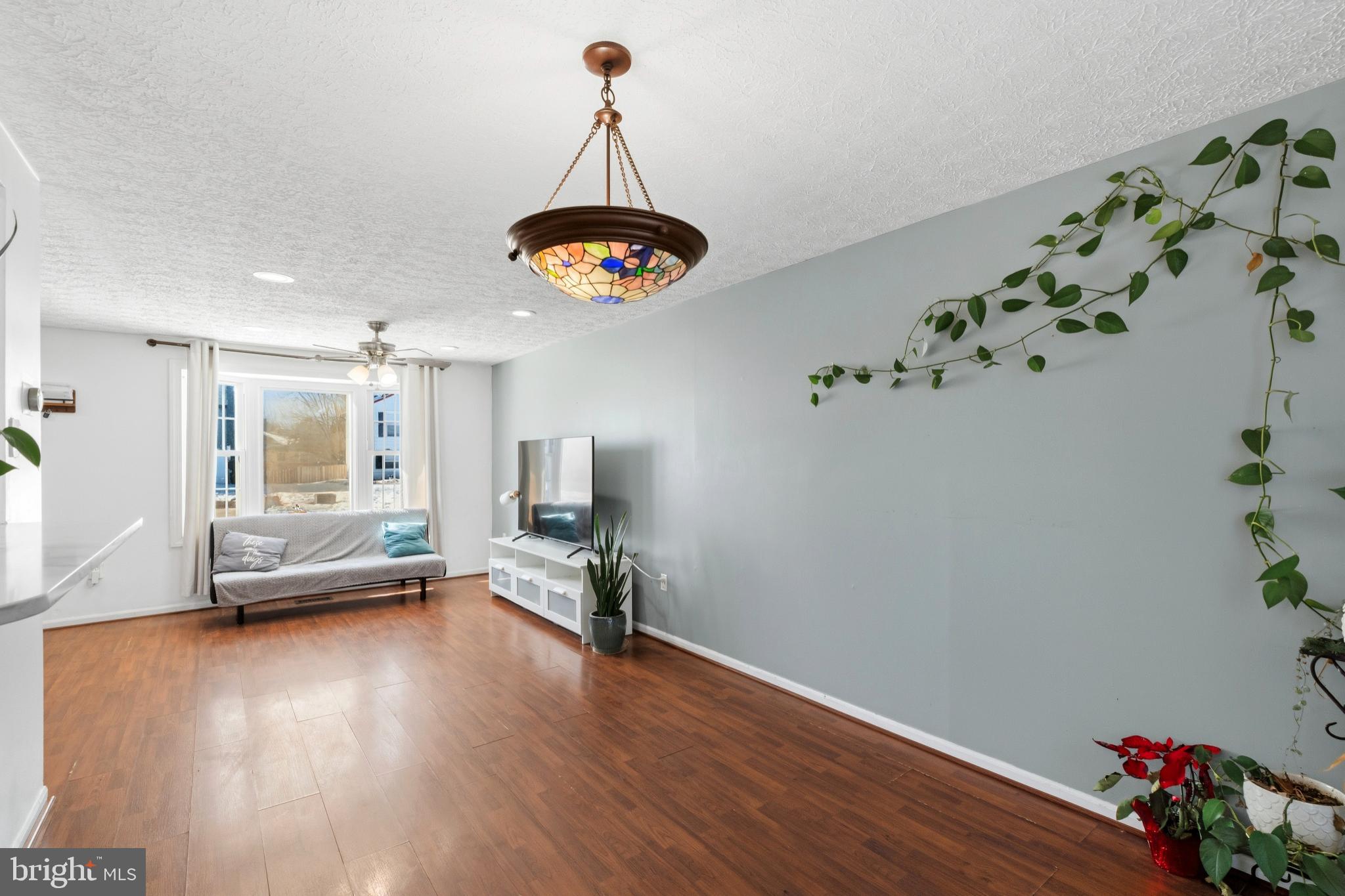 721 Rainbow Court Edgewood, MD 21040 - Photo 7 of 25 a view of a livingroom with furniture wooden floor and a window